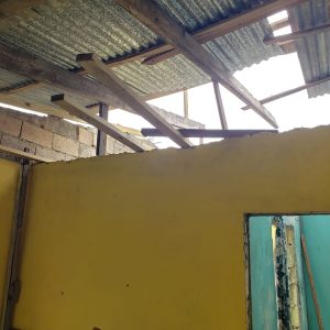 Repairing Roof after Hurricane Melissa